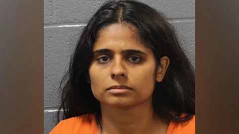 Dr. Neha Gupta in orange jail uniform.