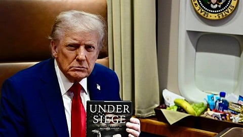 Trump in blue suit with red tie.