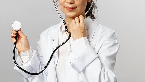 A doctor in white cat with stethoscope