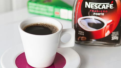 Nescafé coffee cup and bottle.