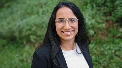 Dr. Aparna Bhaduri in a white tee and black jacket.