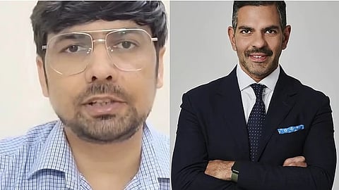 A man in blue shirt and a man in a business suit.
