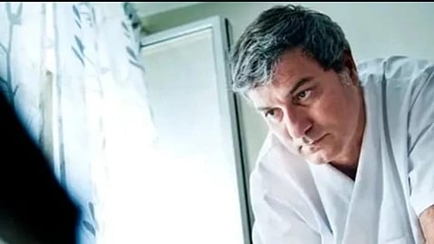 Dr. Paolo in a white coat.