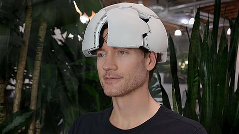 Bryan Johnson wearing a circular device on his head