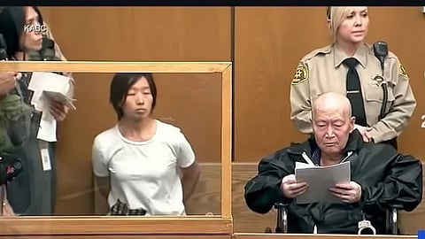 Xuan and Zhang in court with police behind.