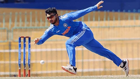 Riyan Parag fielding in his own bowling during an ACC Emerging Cup match.