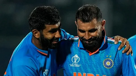 Jasprit Bumra with his 'out of favor' new ball partner Mohammed Shami during the ICC ODI cricket world cup match against New Zealand in Dharamsala on October 22, 2023.