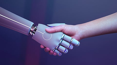 A Robotic hand shake with a human, Symbolic image.