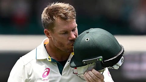 David Warner kisses his helmet after his last Test hundred.