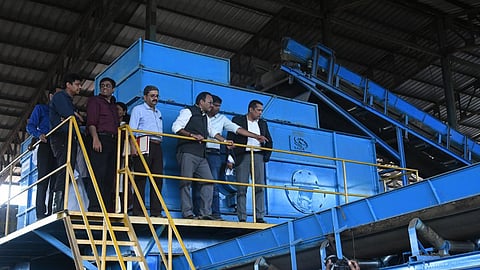 Justice Bechu Kurien Thomas and Justice P. Gopinath at the Brahmapuram waste management plant in Kochi on Thursday