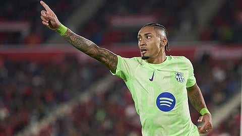 Barcelona's Rafinha celebrates after scoring his second goal against Mallorca in Spanish football league