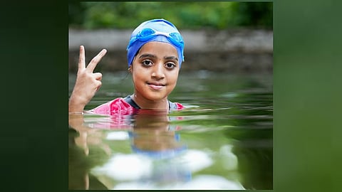 4th class girl swims 7 km across Vembanatu backwater with her hands tied