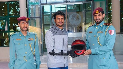 rak police provide helmets to new bike riders
