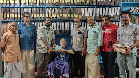 MP Parameswaran handing over his collection to Manoj Karingamadam in Thrissur on Wednesday.