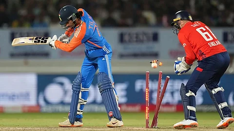 Tilak Varma being cleaned up by Adil Rashid