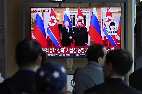 During a news program, Kim Jong-un and Vladimir Putin appeared on a TV screen at Seoul Railway Station