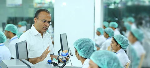 John Kuriakose gives instructions to his employees