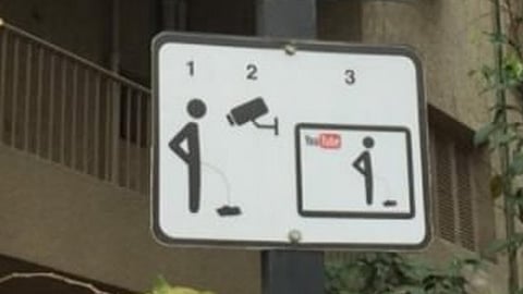 Two booked after video showing them urinating on road goes viral