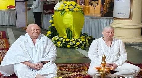 From now on, Prof. Bruce Russell will be known as Swami Brahmananda and Adrian Swamini Chinmayi Devi.