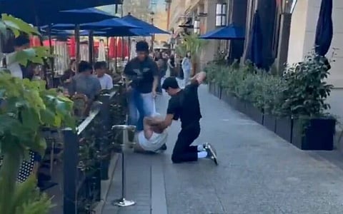 Screenshot from video showing one of two men being beaten outside a San Jose restaurant on March 8, 2026