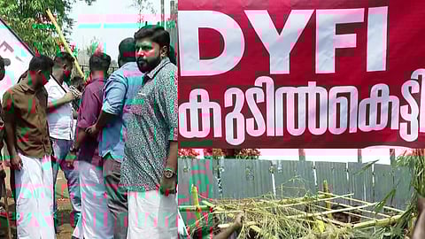 DYFI protest by building huts on land acquired by Congress