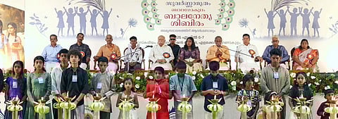 RSS Sarsanghchalak Dr. Mohan Bhagwat watches as children perform 51 chirats at a children's leadership camp held in Kochi.