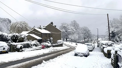 Schools shut, drivers stuck as gales and blizzards batter UK