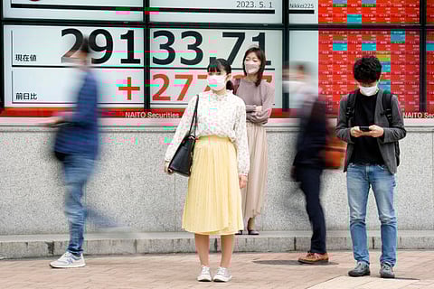 Stock market today: Tokyo gains, most world markets closed