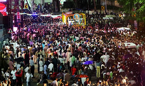 Chandy's final journey to hometown delayed as thousands gather along route throughout night