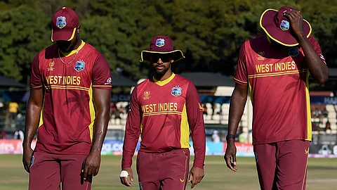 A dejected West Indies team returns after the loss against Scotland in ODI men's World Cup qualifiers held in Zimbabwe.