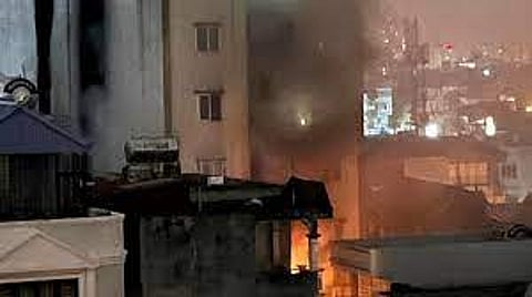 More than a dozen people feared dead in a massive fire at an apartment building in Hanoi