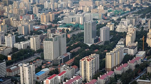China cuts 1-year benchmark rate, moving to boost economy as world markets languish