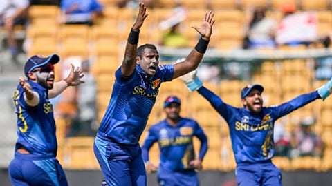 Sri Lankan bowlers slice through England's batting, restrict defending champions to 156