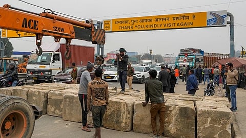 Road blocks being placed at Singhu Border ahead of the scheduled 'Delhi Chalo' march by the protesting farmers in New Delhi.