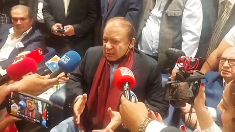 Pakistan Muslim League-Nawaz (PML-N) supremo Nawaz Sharif addresses the media ahead of his return to Pakistan after four years, at Dubai airport, Saturday, Oct. 21, 2023.