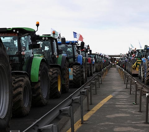 French Farmers Roll into Paris with Tractors