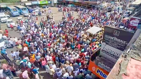 People block the traffic after an eco-tourism guide died due to elephant attack in Wayanad.
