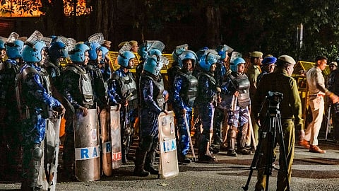 Security personnel deployed outside the residence of Delhi Chief Minister Arvind Kejriwal, in New Delhi, Thursday, March 21, 2024. An ED team has reached Kejriwal's residence Thursday evening, after the Delhi High Court refused to grant him protection from coercive action in an excise policy-linked money laundering case.