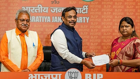 JMM legislator Sita Soren, the sister-in-law of former Jharkhand chief minister Hemant Soren, being received by BJP leaders Vinod Tawde and Laxmikant Bajpai as she joins the party in New Delhi, Tuesday, March 19, 2024.