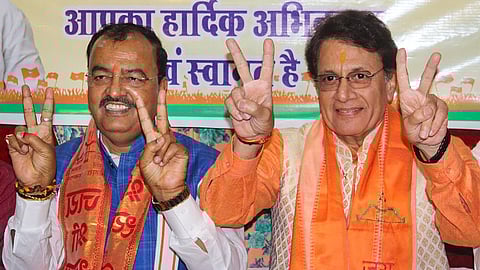 UP Deputy CM Keshav Prasad Maurya with BJP candidate Arun Govil during a road show ahead of the Lok Sabha elections, in Meerut, Tuesday, April 2, 2024.