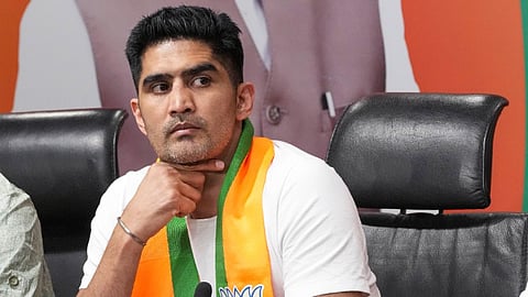 Vijender Singh on stage after joining BJP.