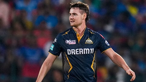 Gujrat Titans bowler Joshua Little celebrates after taking the wicket of Royal Challengers Bengaluru batter Faf du Plessis during the Indian Premier League (IPL) 2024 T20 cricket match between Royal Challengers Bengaluru and Gujrat Titans, at M Chinnaswamy Stadium in Bengaluru, Saturday, May 4, 2024.