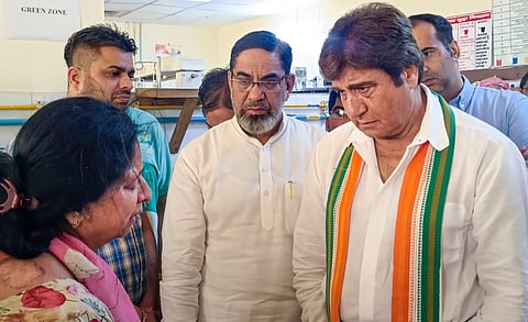 Congress candidate from Gurugram constituency Raj Babbar interacts with a bereaved family member of one of the victims.