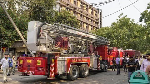 Firefighting team outside the Income Tax CR Building after a fire broke out here, in ITO area of New Delhi, Tuesday, May 14, 2024.