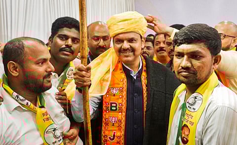 Maharashtra Deputy Chief Minister Devendra Fadnavis during a campaign for Lok Sabha elections, in Thane, Saturday, May 18, 2024.