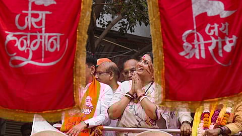 Union Minister Smriti Irani during a roadshow in support of BJP candidate from East Delhi constituency Harsh Malhotra for Lok Sabha polls, in New Delhi, Thursday, May 23, 2024.