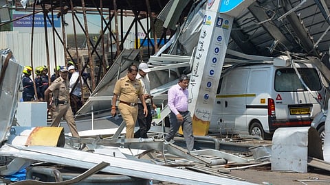 View of the site of the hoarding collapse, that is being cooled by the fire brigade personnel at Ghatkopar, in Mumbai, Tuesday, May 14, 2024.