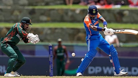 India's Hardik Pandya, right, plays a shot during the ICC Men's T20 World Cup cricket match between India and Bangladesh at Sir Vivian Richards Stadium in North Sound, Antigua and Barbuda, Saturday, June 22, 2024.
