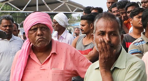 Workers at the site after a blast at an explosive-manufacturing factory, near Nagpur, Thursday, June 13, 2024.