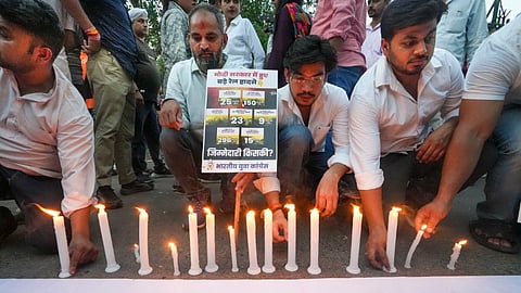 Indian Youth Congress workers during a candle march in memory of the passengers killed in Kanchenjunga Express train accident, in New Delhi, Tuesday, June 18, 2024.